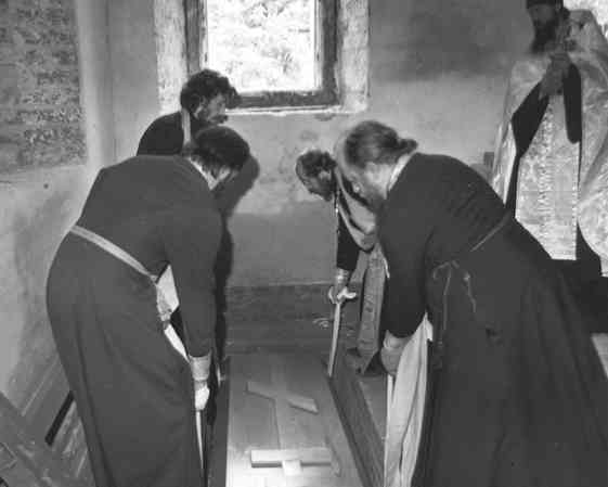 Lowering the coffin into the crypt in the Church of the Savior